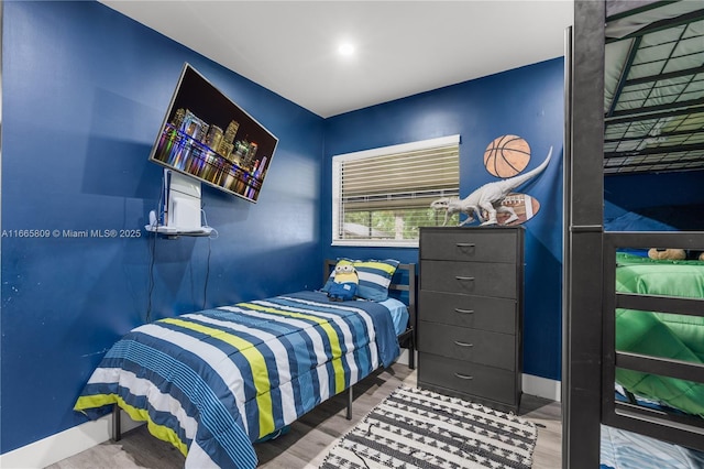 bedroom with wood-type flooring