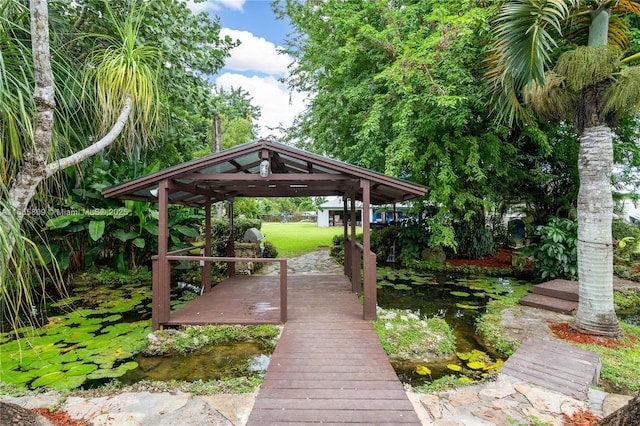 dock area featuring a lawn