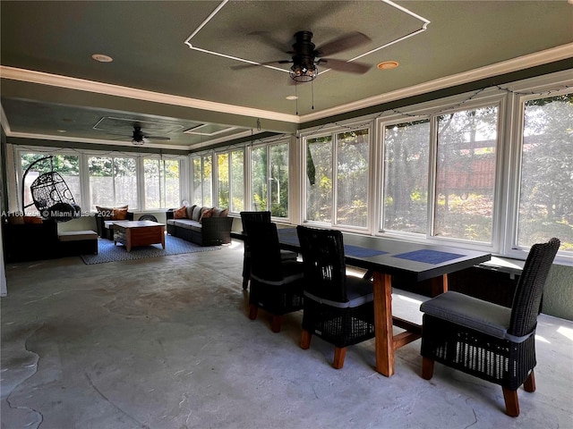 sunroom / solarium featuring ceiling fan