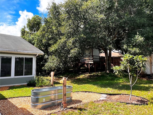 view of yard featuring a deck