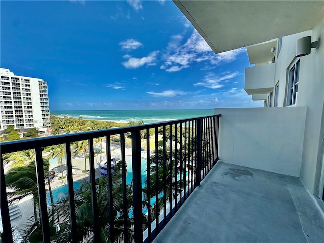 balcony with a view of the beach and a water view