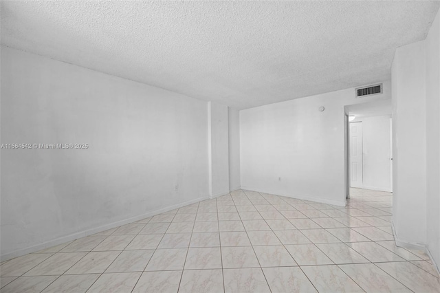 empty room with a textured ceiling