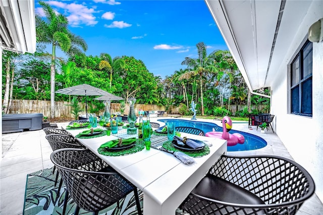 view of patio / terrace with a fenced in pool