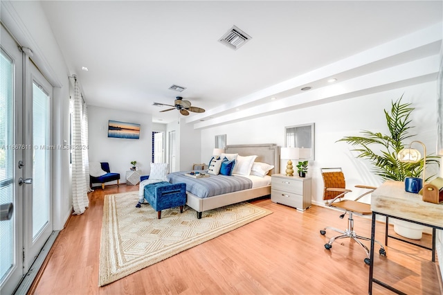 bedroom featuring access to outside, multiple windows, ceiling fan, and light hardwood / wood-style floors