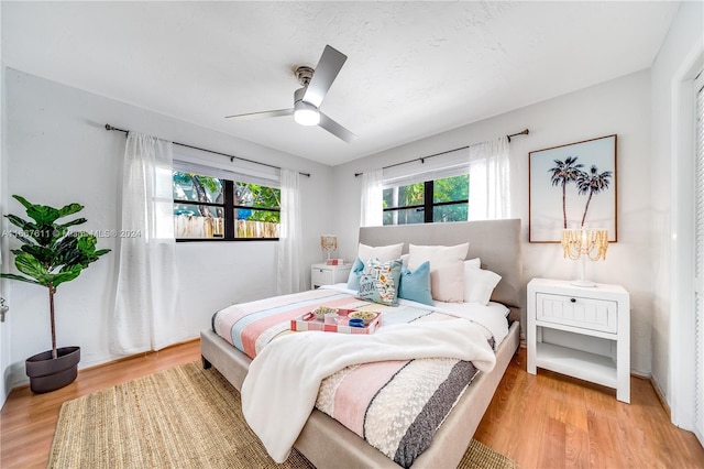 bedroom with hardwood / wood-style flooring and ceiling fan