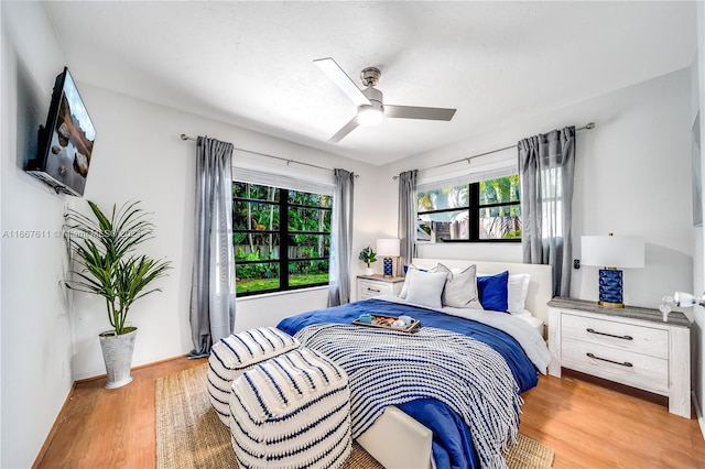 bedroom featuring light hardwood / wood-style flooring and ceiling fan