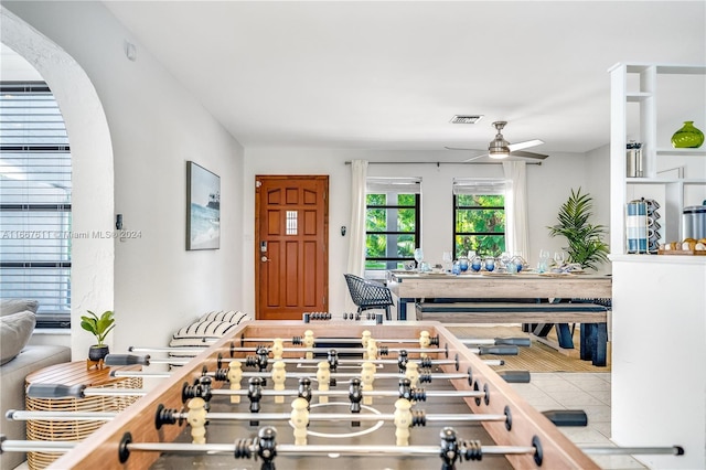 interior space featuring ceiling fan