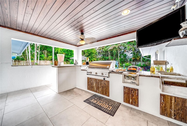 view of patio / terrace featuring an outdoor kitchen, grilling area, and ceiling fan