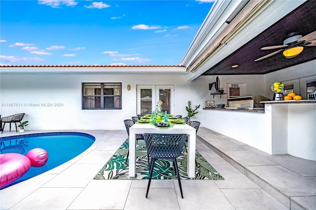 view of patio / terrace featuring ceiling fan