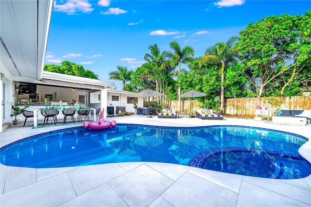 view of pool with an outdoor hangout area and a patio area