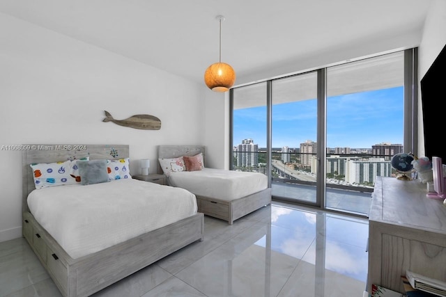 bedroom with access to outside, expansive windows, and multiple windows