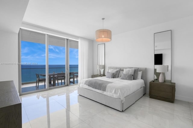 bedroom with access to outside, a water view, and floor to ceiling windows