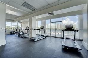 exercise room with a paneled ceiling