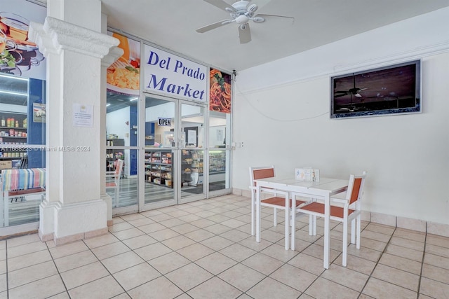 dining space with ceiling fan and light tile patterned floors