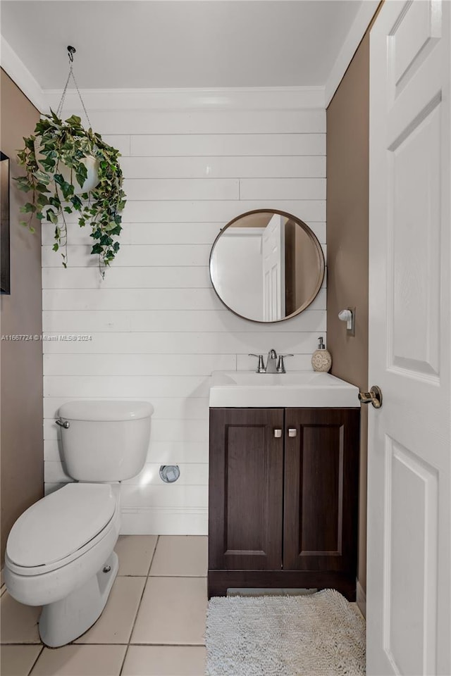 bathroom with tile patterned floors, vanity, and toilet