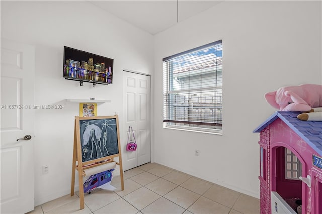 recreation room featuring light tile patterned floors