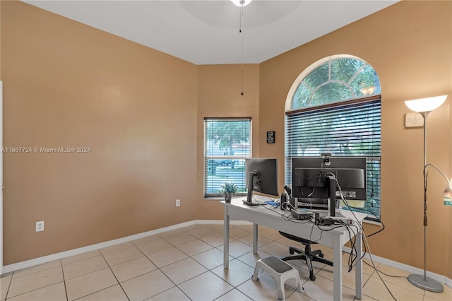 home office featuring ceiling fan and light tile patterned floors