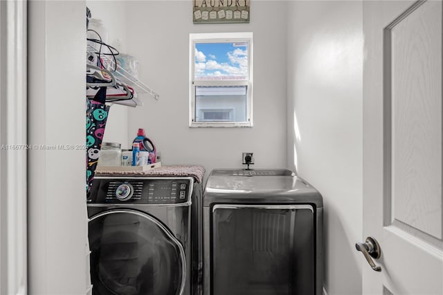 laundry room with washing machine and dryer