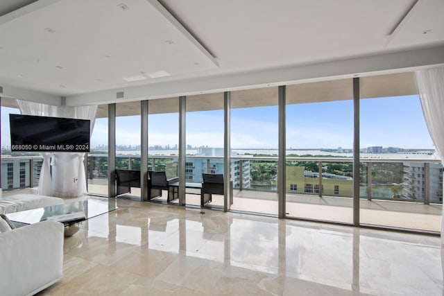 unfurnished living room featuring a wall of windows