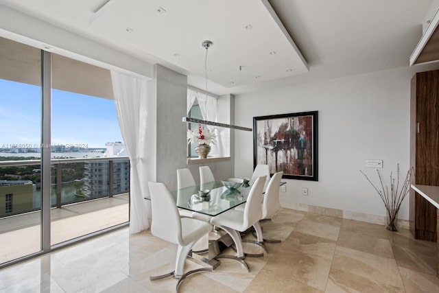 dining space featuring expansive windows