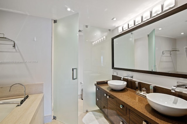 bathroom featuring walk in shower and vanity