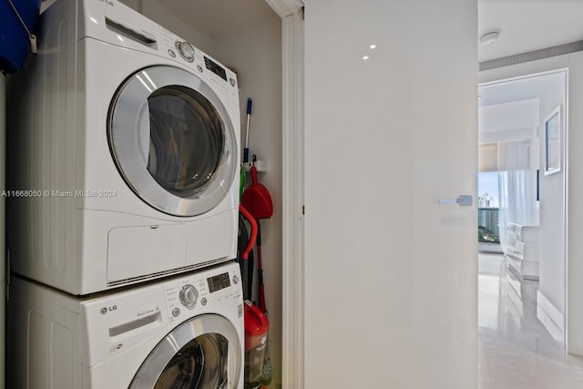 washroom with stacked washer / drying machine