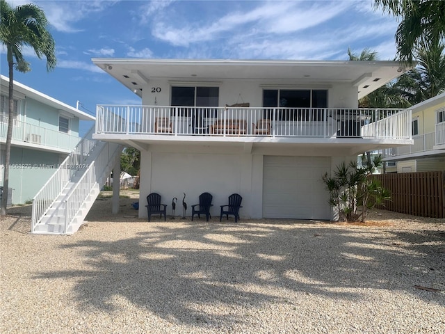 back of property with a garage