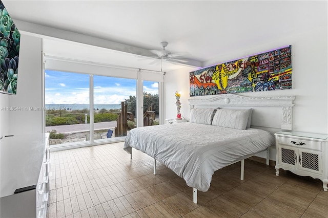 bedroom with ceiling fan and access to exterior