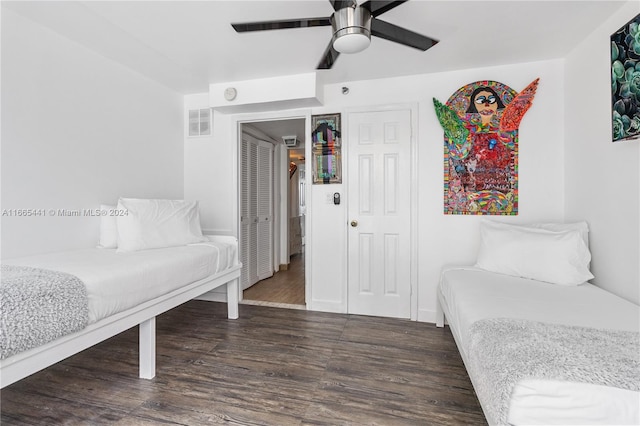 bedroom featuring ceiling fan and dark hardwood / wood-style floors