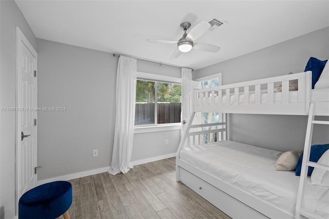 bedroom featuring wood-type flooring and ceiling fan