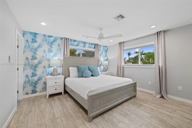 bedroom featuring ceiling fan and light hardwood / wood-style floors