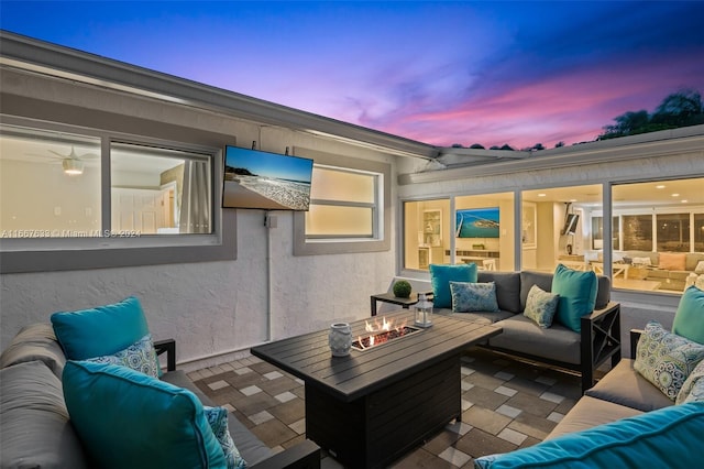 view of patio / terrace featuring an outdoor living space with a fire pit