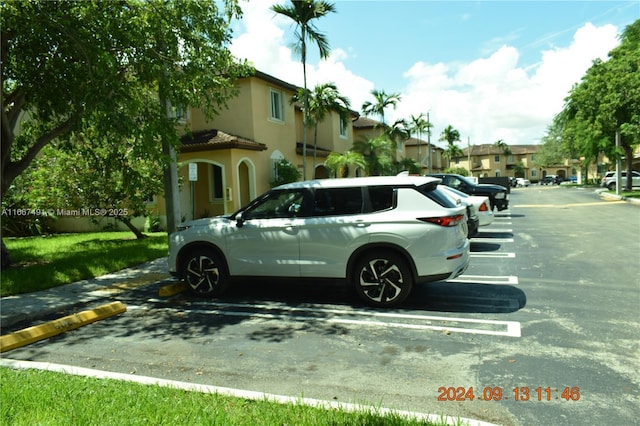 view of parking featuring a residential view