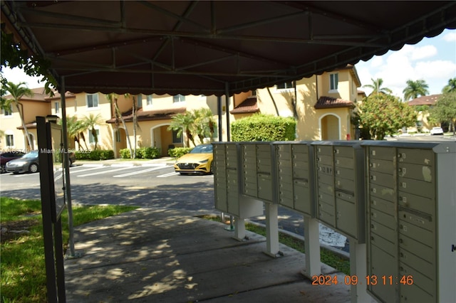 view of community with a residential view and mail area