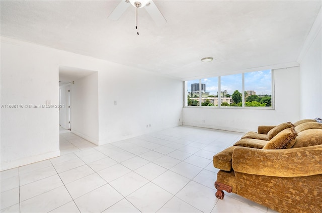 tiled living room featuring crown molding and ceiling fan