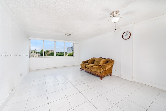 sitting room featuring ceiling fan, crown molding, a textured ceiling, and light tile patterned flooring