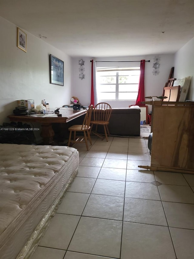 bedroom featuring light tile patterned floors