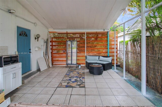 view of patio / terrace featuring a garage