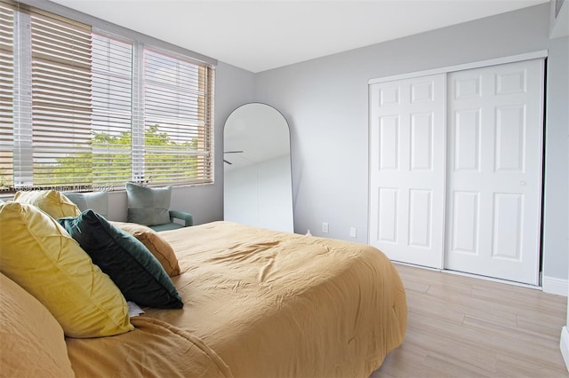 bedroom featuring a closet and light hardwood / wood-style floors