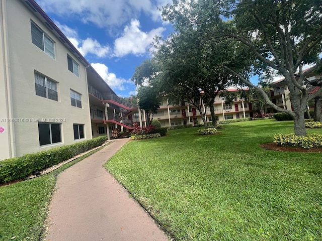 view of community featuring a lawn