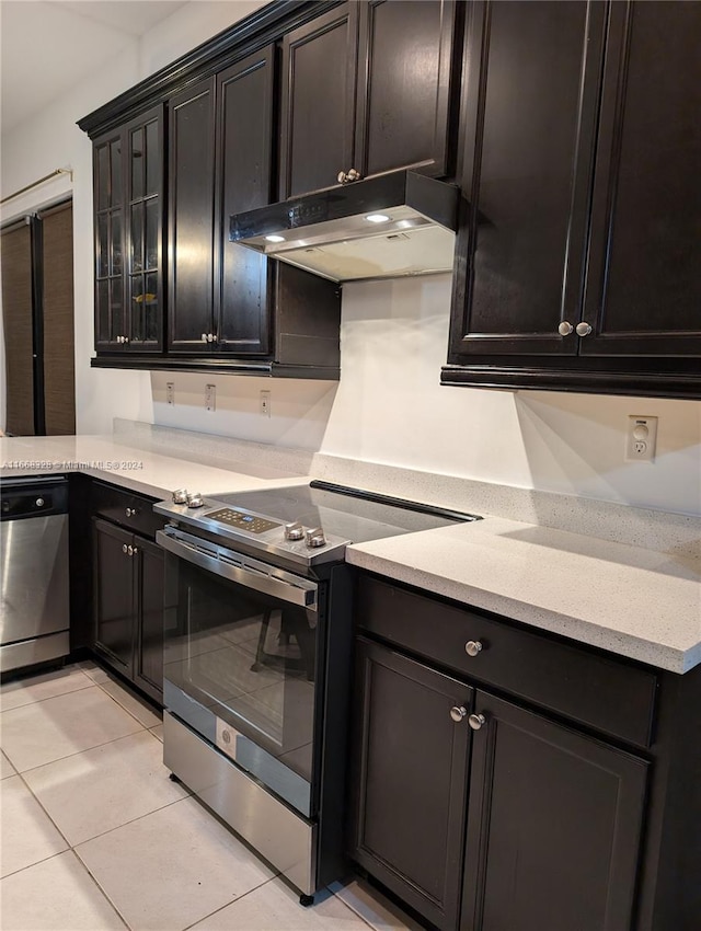 kitchen featuring appliances with stainless steel finishes and light tile patterned floors