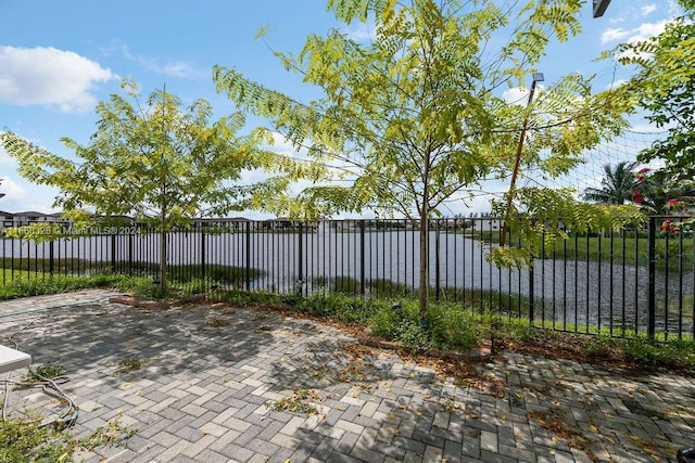 view of patio with a water view