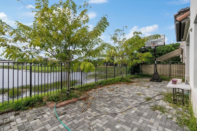 view of patio / terrace featuring a water view