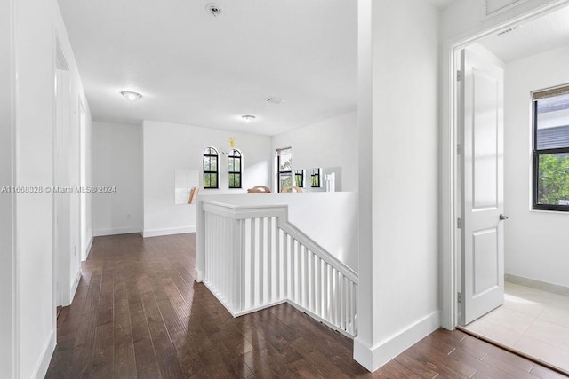 hall with hardwood / wood-style flooring