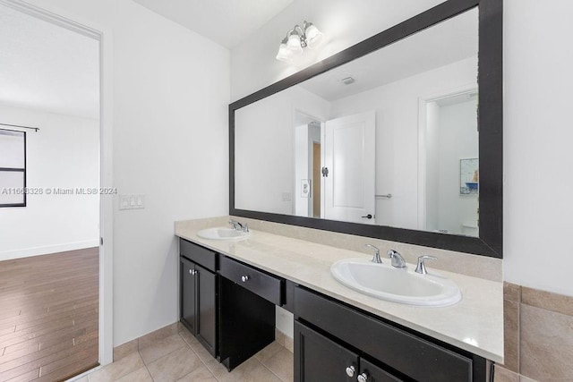 bathroom featuring vanity and hardwood / wood-style floors