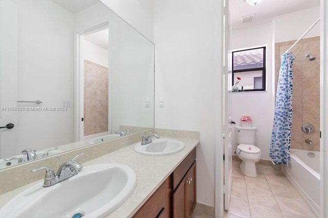 full bathroom featuring tile patterned flooring, vanity, toilet, and shower / bathtub combination with curtain