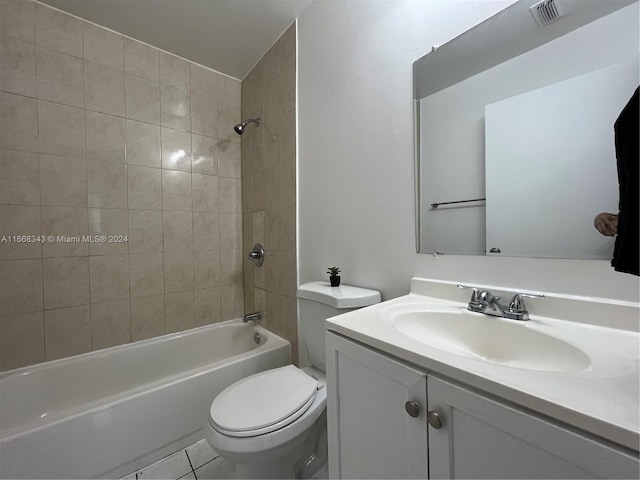 full bathroom with vanity, toilet, tile patterned floors, and tiled shower / bath