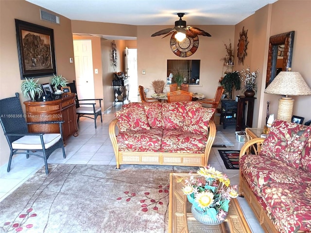 tiled living room featuring ceiling fan