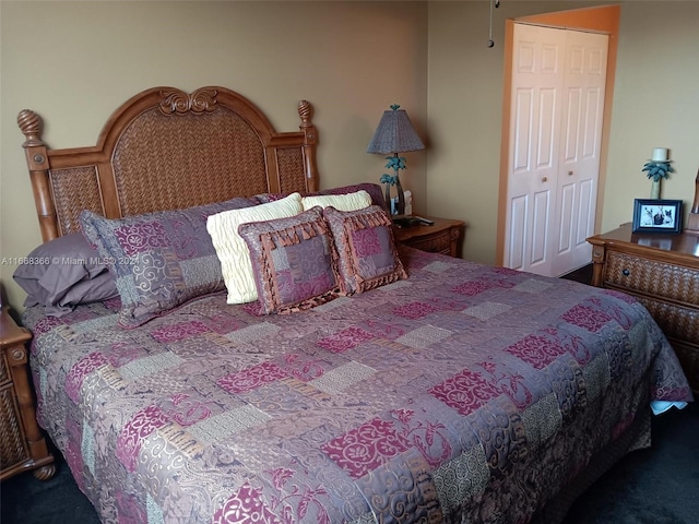 bedroom with carpet floors and a closet