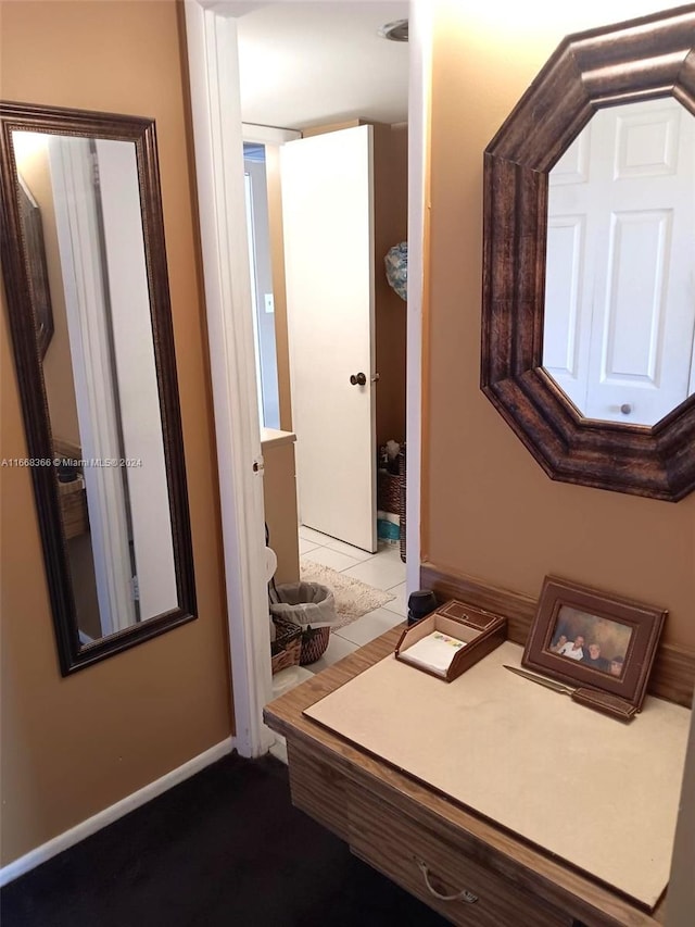 bathroom with tile patterned floors